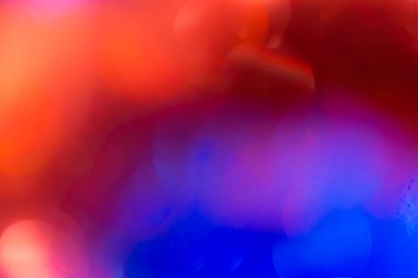 Soyut mavi ve kırmızı, dairesel fakül çözünürlüğü. Bokeh bulanık renk ışığı arka planı kullanabilir