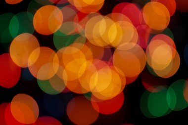 Soyut renkli, odaklanmış dairesel fakül. Bokeh bulanık renk ışığı arka planı kullanabilir. Yeni yıl Bokeh feshi