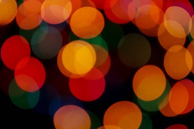 Soyut renkli, odaklanmış dairesel fakül. Bokeh bulanık renk ışığı arka planı kullanabilir. Yeni yıl Bokeh feshi