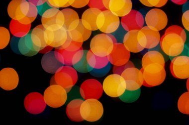 Soyut renkli, odaklanmış dairesel fakül. Bokeh bulanık renk ışığı arka planı kullanabilir. Yeni yıl Bokeh feshi