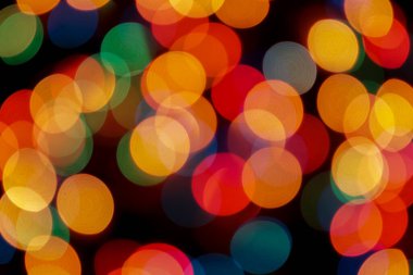 Soyut renkli, odaklanmış dairesel fakül. Bokeh bulanık renk ışığı arka planı kullanabilir. Yeni yıl Bokeh feshi