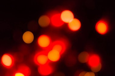 Soyut kırmızı ve siyah odaklı dairesel fakül. Bokeh bulanık renk ışığı arka planı kullanabilir