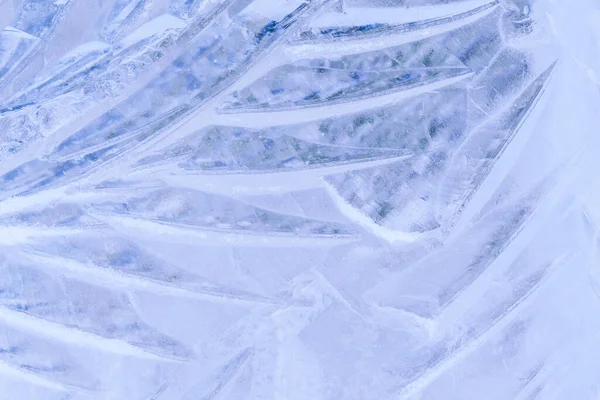 blue ice texture with a pattern and cracks background, ice frozen rink winter background, texture of ice surface for designers,  blocks frozen water