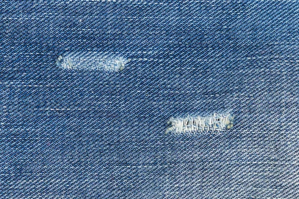 Rippade Blå Jeans Med Ett Hål Konsistens Bakgrund — Stockfoto