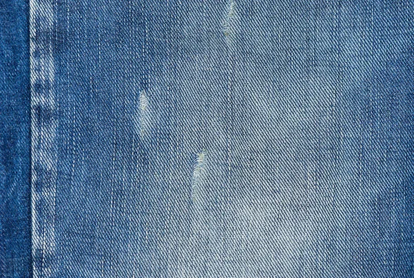 Rippade Blå Jeans Med Ett Hål Konsistens Bakgrund — Stockfoto