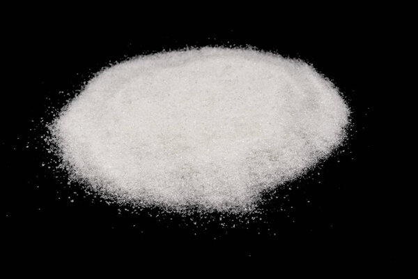 Scattered sugar on a black background