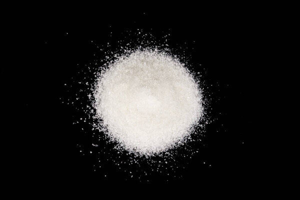 Scattered sugar on a black background