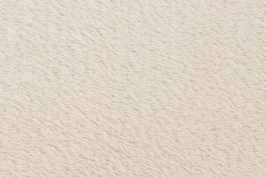 Beyaz desenli beyaz doğal yün. Beyaz, pürüzsüz, yün ekose. Tasarımcılar için tüylü kürk dokusu, yakın plan beyaz yün halı