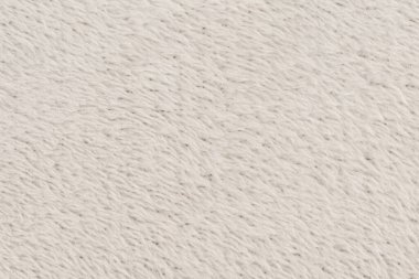 Beyaz desenli beyaz doğal yün. Beyaz, pürüzsüz, yün ekose. Tasarımcılar için tüylü kürk dokusu, yakın plan beyaz yün halı