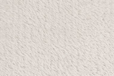 Beyaz desenli beyaz doğal yün. Beyaz, pürüzsüz, yün ekose. Tasarımcılar için tüylü kürk dokusu, yakın plan beyaz yün halı