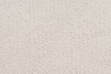 Beyaz desenli beyaz doğal yün. Beyaz, pürüzsüz, yün ekose. Tasarımcılar için tüylü kürk dokusu, yakın plan beyaz yün halı