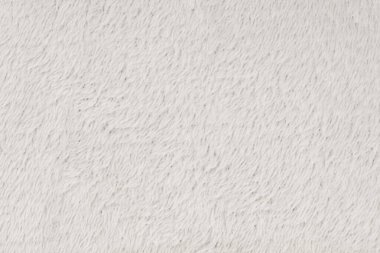 Beyaz desenli beyaz doğal yün. Beyaz, pürüzsüz, yün ekose. Tasarımcılar için tüylü kürk dokusu, yakın plan beyaz yün halı