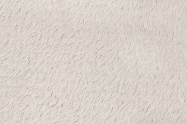 Beyaz desenli beyaz doğal yün. Beyaz, pürüzsüz, yün ekose. Tasarımcılar için tüylü kürk dokusu, yakın plan beyaz yün halı