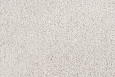 Beyaz desenli beyaz doğal yün. Beyaz, pürüzsüz, yün ekose. Tasarımcılar için tüylü kürk dokusu, yakın plan beyaz yün halı