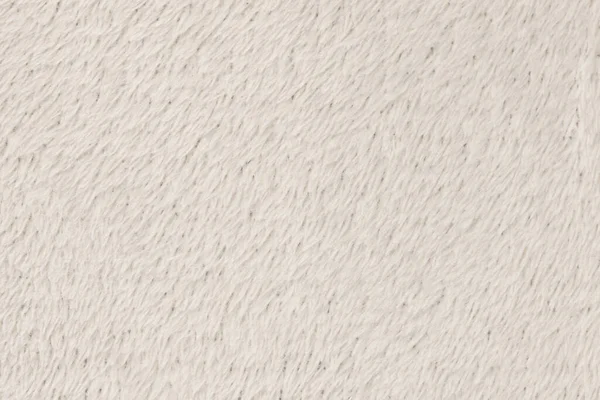 White  natural wool with white texture background. white seamless woolen plaid. texture of fluffy fur for designers, close-up fragment white wool carpet