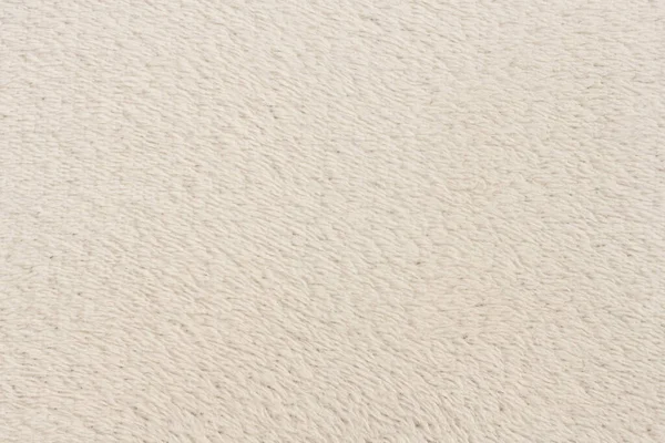 Beyaz desenli beyaz doğal yün. Beyaz, pürüzsüz, yün ekose. Tasarımcılar için tüylü kürk dokusu, yakın plan beyaz yün halı