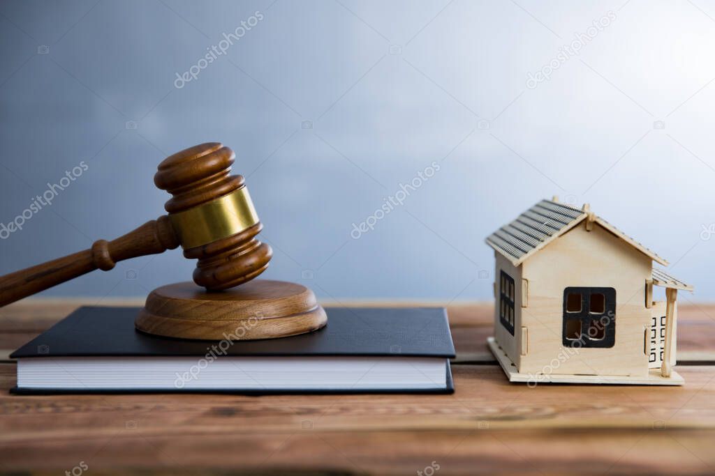 house model  and judge on books on tabl