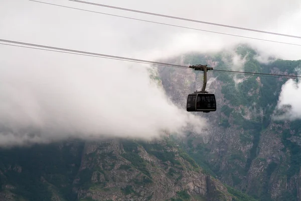 Cable car with fog at high altitud