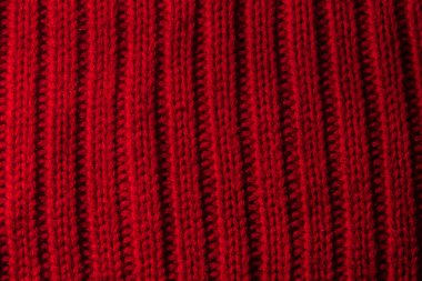 Örme doku kalın iplik, örgü ve düz çizgiler kırmızı arka plan