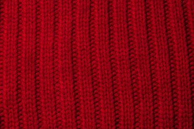 Örme doku kalın iplik, örgü ve düz çizgiler kırmızı arka plan