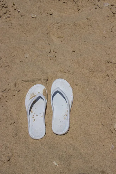 White Female Slippers Lie Sand Sea Stock Picture