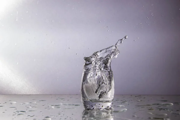 water splash in a glass isolated on white background