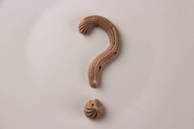 Question mark written with whipped chocolate cream clipart