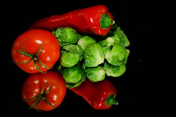 Close up view of vegetables on black background