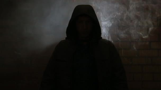 A young guy in a smoky room — Stock Video