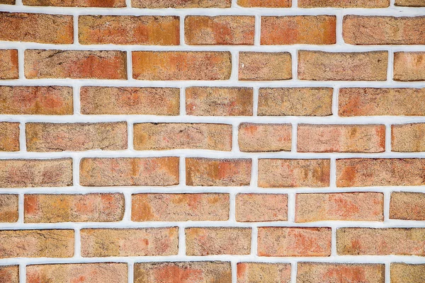 Die Ziegelwand des rissigen Dekorziegels ist rot .texture.background. — Stockfoto