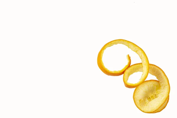 The peel is coiled isolated on a white background. Tropical fruit — Stock Photo, Image