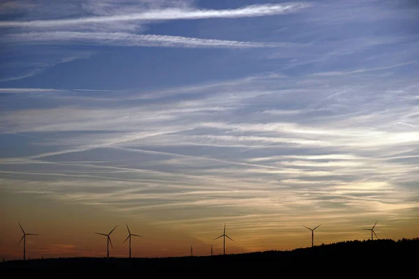 Silhouettes Wind Turbines Front Evening Sky Silhouettes Wind Turbines Wooded — Stock Photo, Image