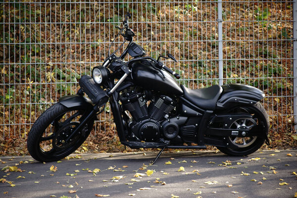 Black Harley Davidson motorcycle / A black matt painted Harley Davidson motorcycle in a parking lot on October 06, 2017 in Dreieich