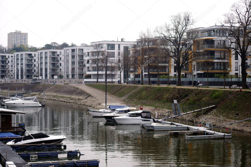 Victor-Hugo-shore Mainz / Motorboats and small yachts in inland harbor at the Victor Hugo shore with residential buildings in the background