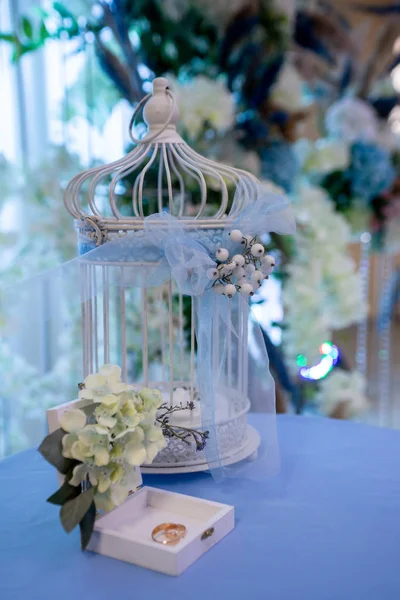 wedding rings in a box, decorated birdcage