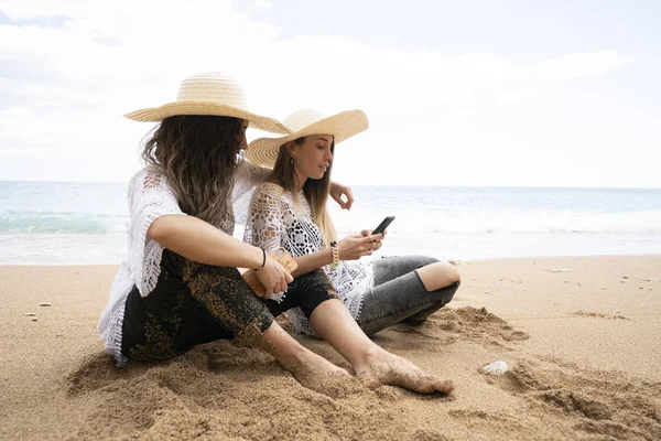 Girls Using Mobile Phone Beach Stock Photo