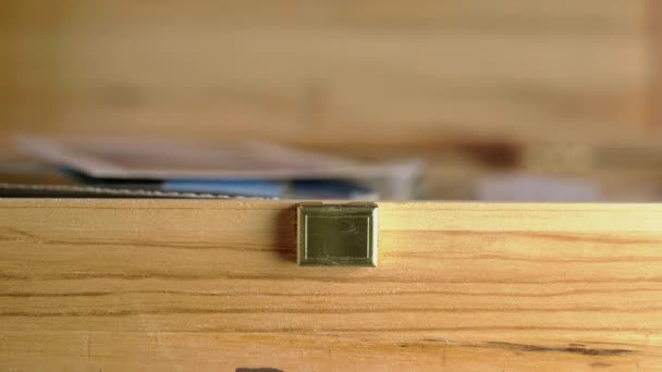 Foreground Detail Wooden Box Focus Background Fingers Packing Old Photos — Stock Video