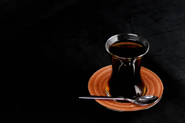 A cup of tea on a black background — Stock Photo, Image