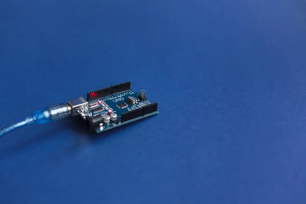 TERNOPIL, UKRAINE - May 5, 2019: Arduino Uno boards for programming education development platform connected to PC with a USB cable. Micro controller. Technology. Electronic computing machine. Concept