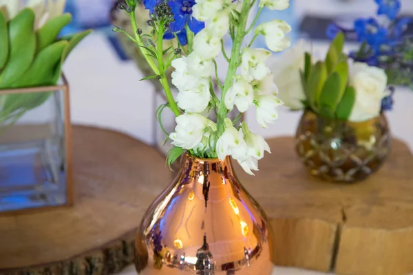 gala dinner banquet event company formal event with copper vase and white flowers