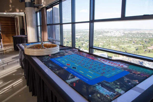 black jack table at a gala dinner with city skyline at the back