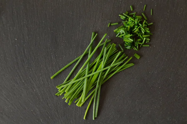 Chives Herb Whole Chopped Black Slate Plate Background — Stock Photo, Image