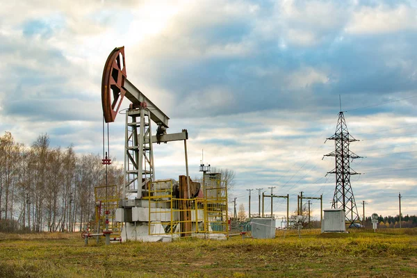 oil rocking in the field in the fall. Russia. republic of bashkortostan. Rosneft, Bashneft, background of blue sky in the summer