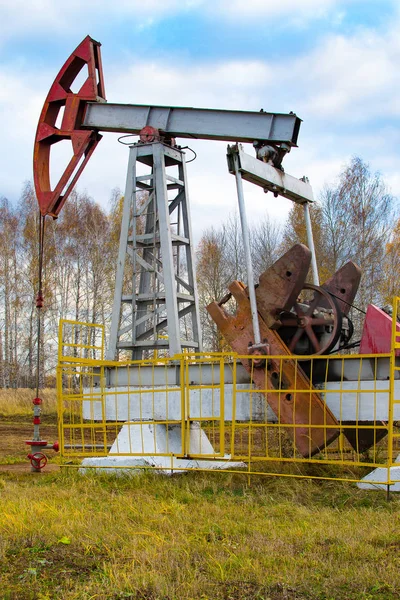 oil rocking in the field in the fall. Russia. republic of bashkortostan. Rosneft, Bashneft, background of blue sky in the summer