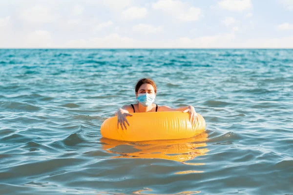 Social Distance Virus Protection Woman Medical Mask Swims Sea Inflatable — Stock Photo, Image