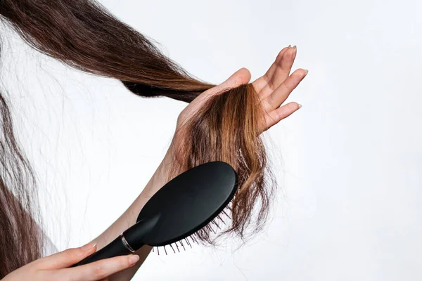 Brunette Woman Smiles Combs Her Hair White Background Lock Hair — Stock Photo, Image