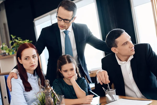 Lawyer calming family with little girl who getting divorced