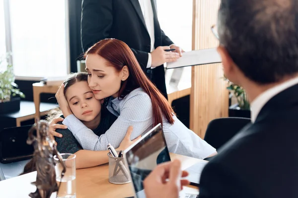 Young Sad Mother Hugging Little Upset Daughter Sitting Lawyer Office — Stock Photo, Image