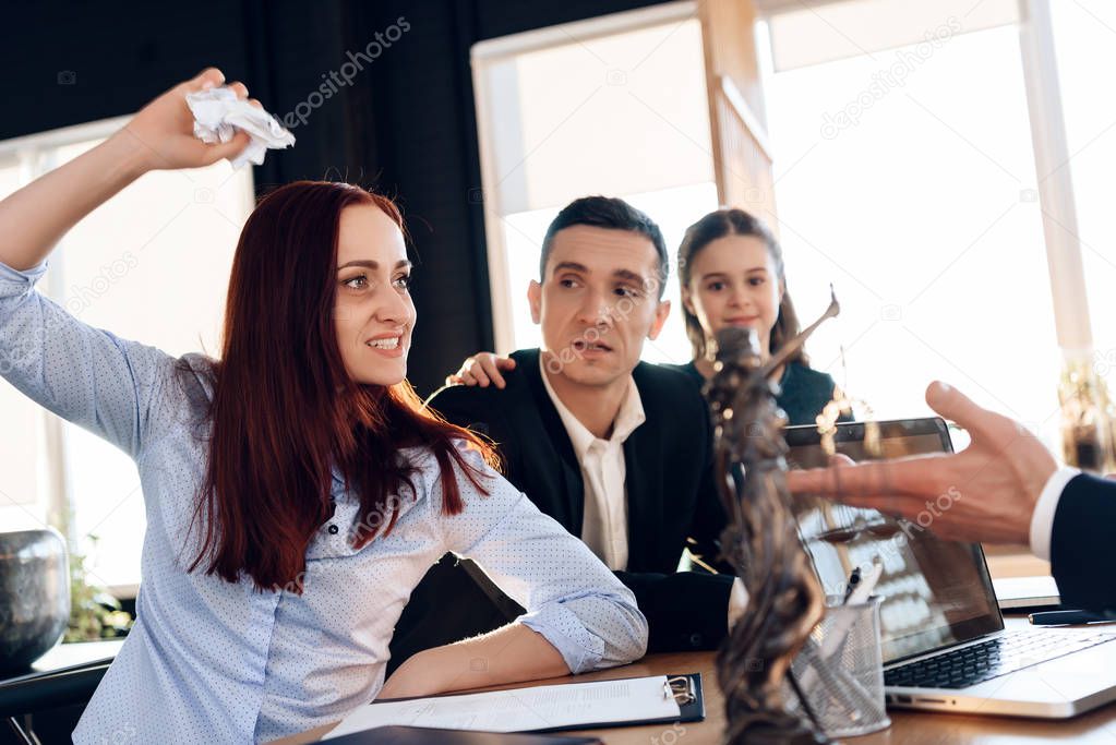 Oppressed mother deprived of rights guardianship of child, sitting in office of lawyer with family