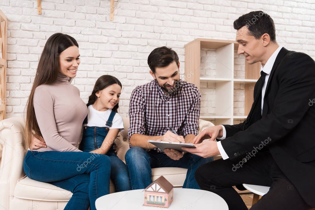 man signing agreement, family buying new apartment in real estate agency